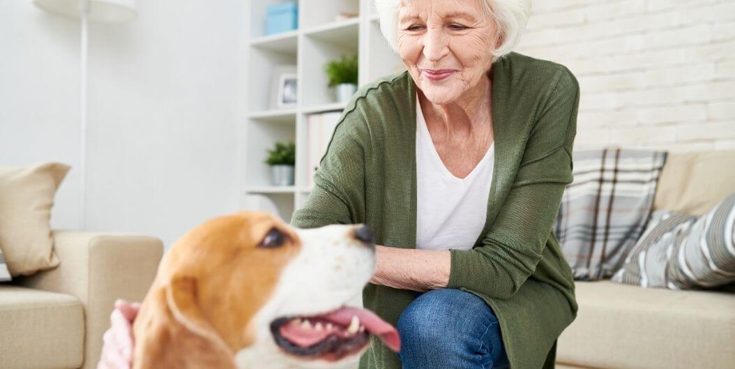 Elderly Woman Enjoying Her Pet Dog at Independent Living Facility