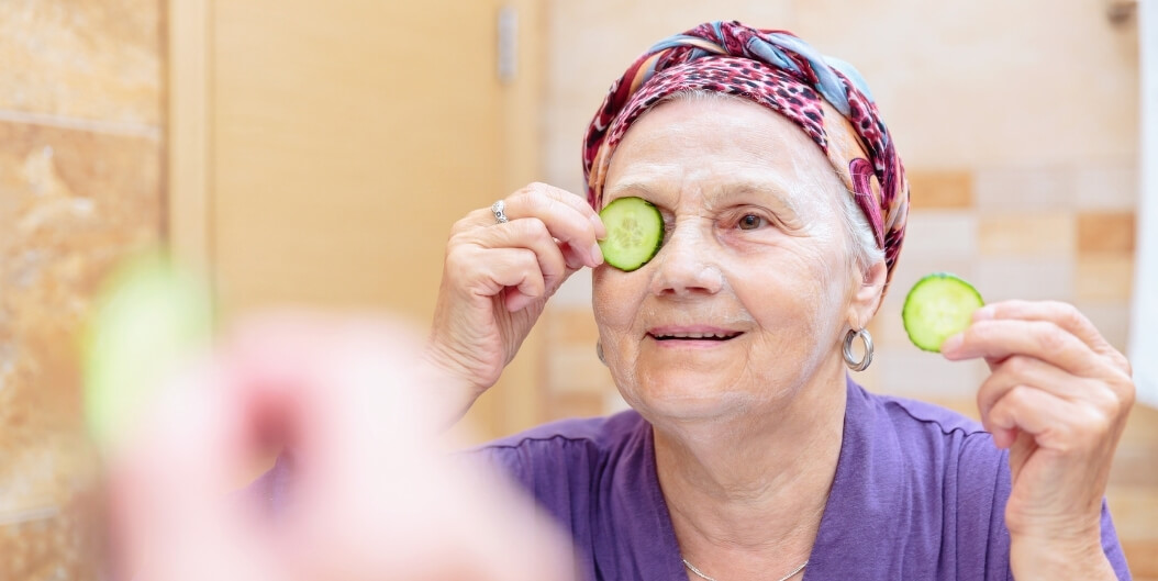 Elderly Woman Holding a Passport with a Suitcase at an Independent Living Facility