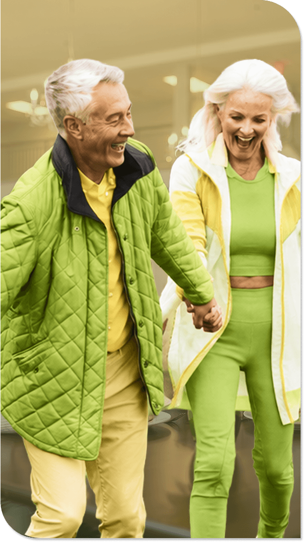 Active Elderly Couple Walking Hand in Hand Outdoors at an Independent Living Facility