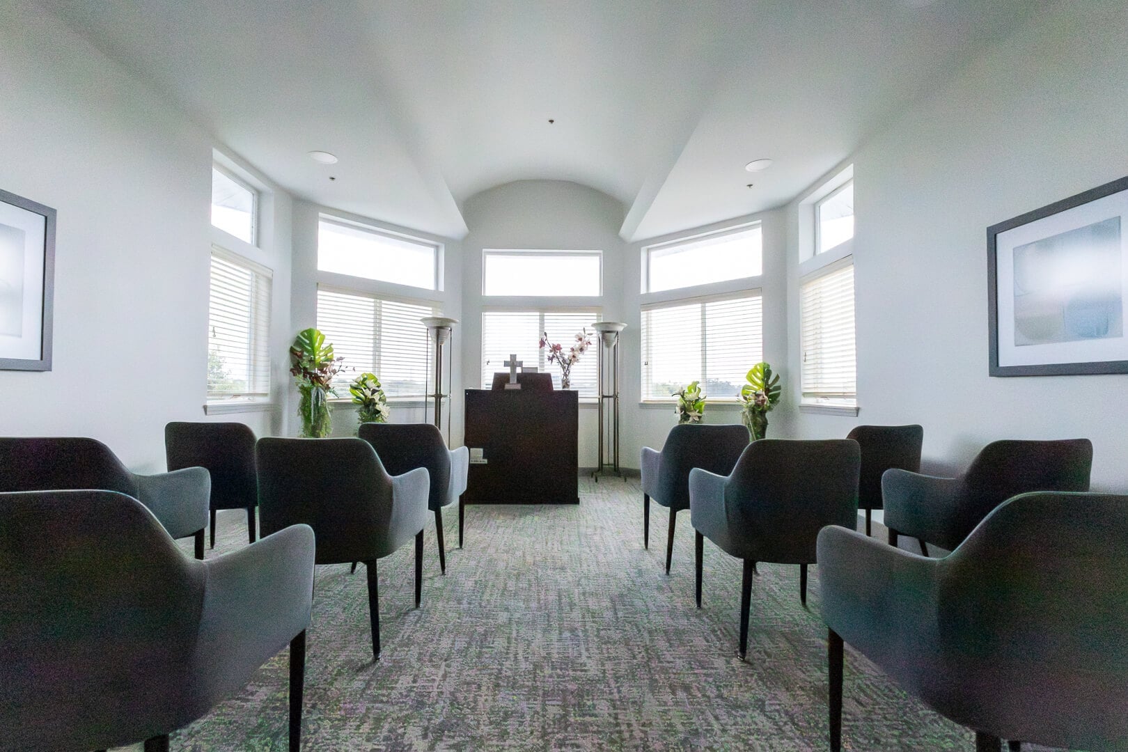 Intimate Chapel With Arched Ceiling and Cross at an Independent Living Facility