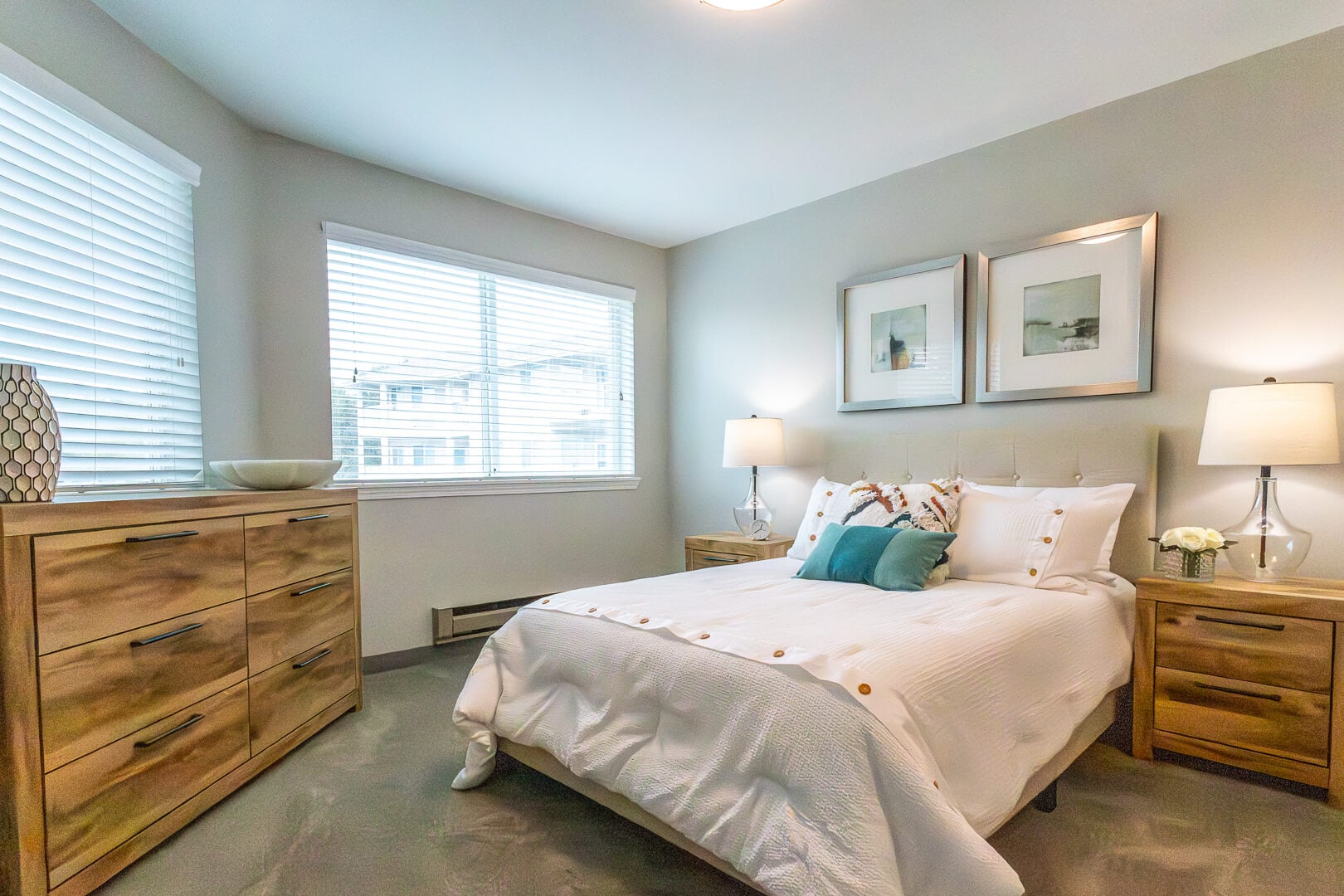 Spacious Elderly Resident Bedroom With Warm Wood Accents at an Independent Living Facility