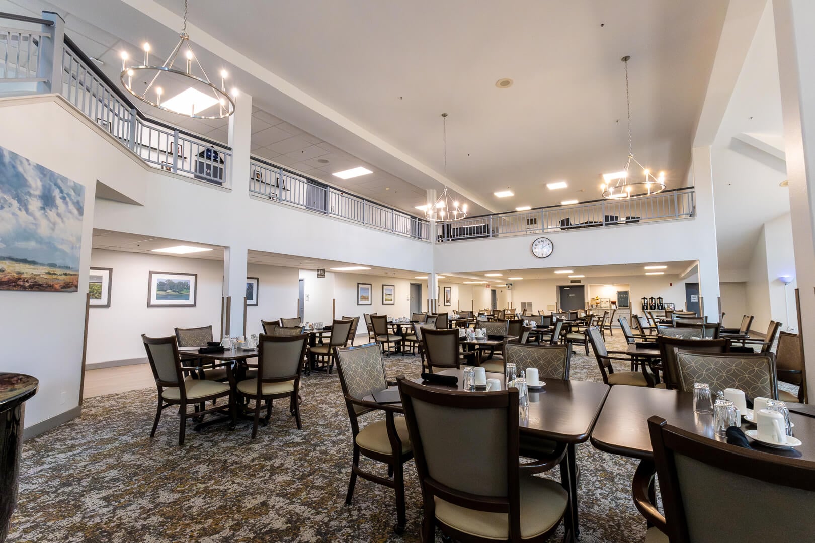 Spacious Two-Story Dining Hall With Chandeliers for Elderly Residents at an Independent Living