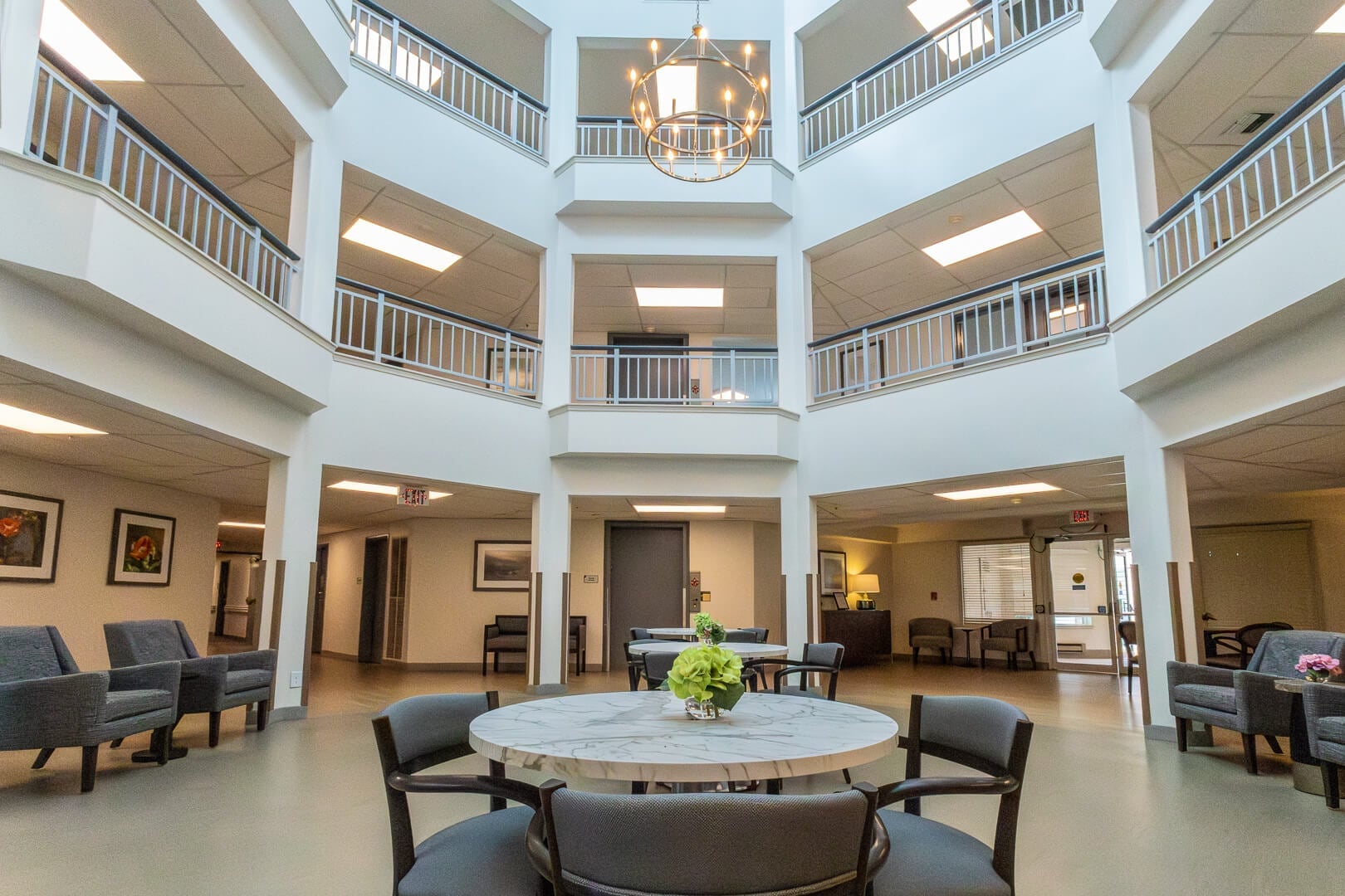 Bright Multi-Level Atrium Lobby With Marble Center Table at an Independent Living Community
